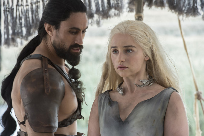 Joe Naufahu and Emilia Clarke in “Game of Thrones.” Credit Macall B. Polay/HBO
